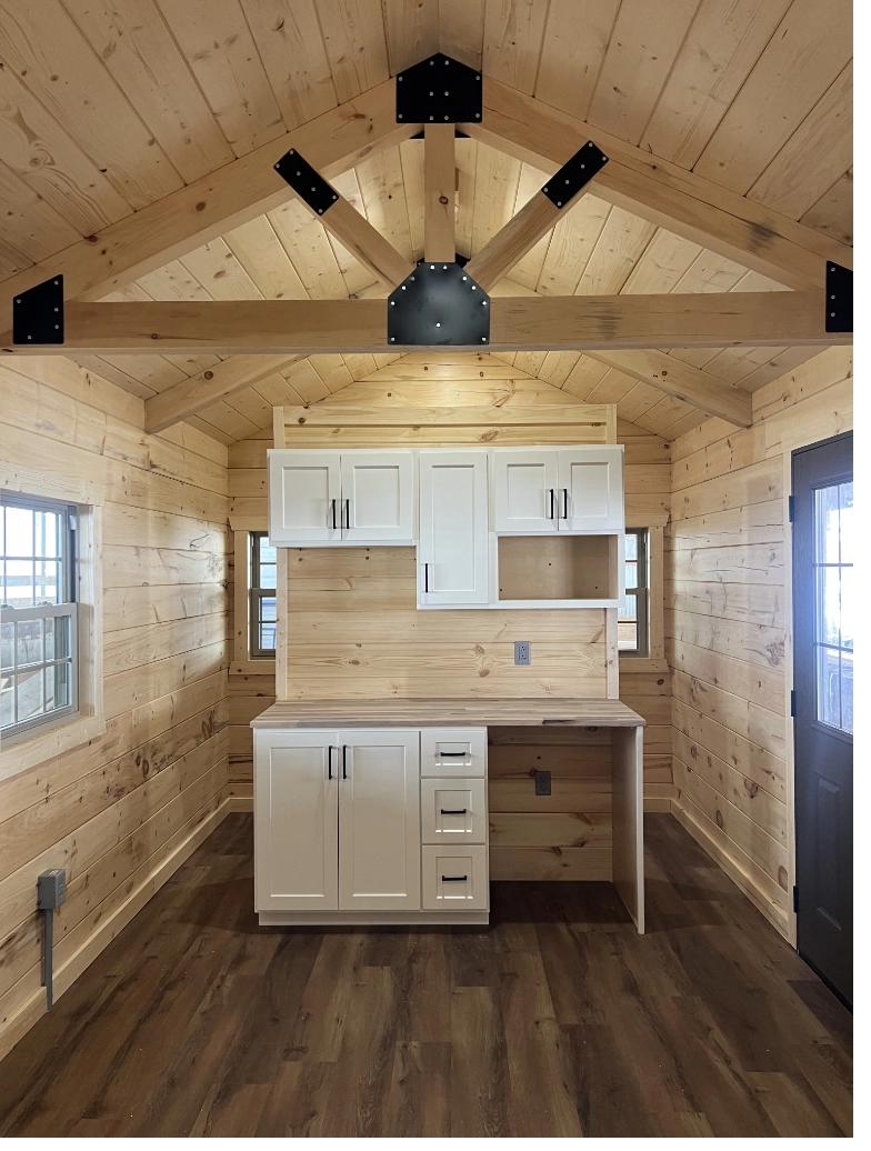 Orana Cabin kitchen with white shaker cabinets and cathedral ceiling